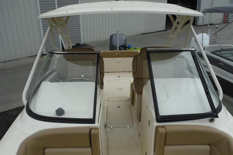 Slide: The Image of 2017 Scout 255 Dorado boat interior with dual consoles and seating. - 11