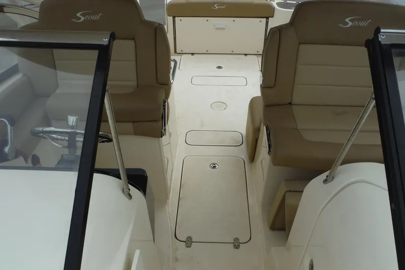 Slide: The Image of 2017 Scout 255 Dorado boat interior with tan seating and steering wheel. - 13