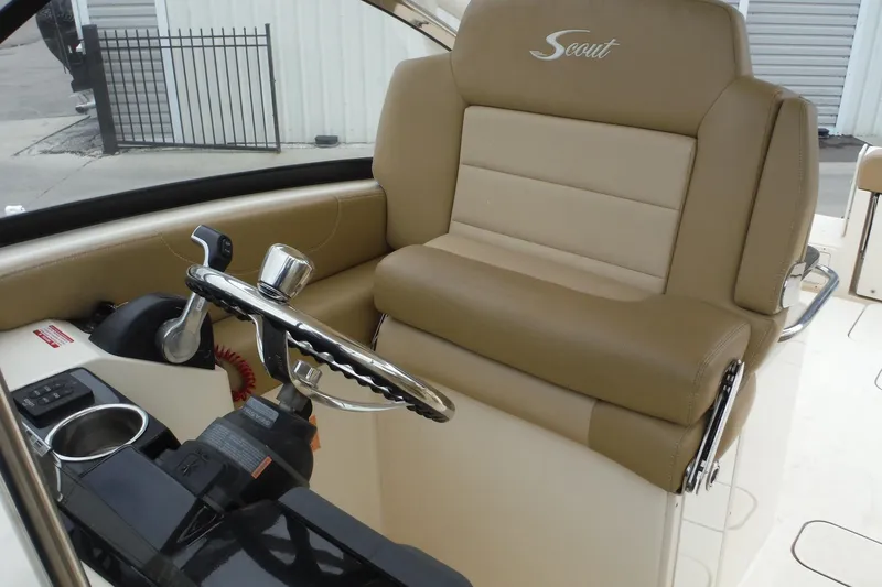 Slide: The Image of 2017 Scout 255 Dorado helm seat with steering wheel and controls. - 15