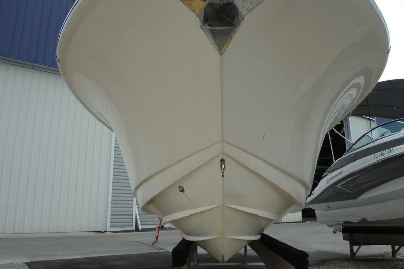 Slide: The Image of 2017 Scout 255 Dorado boat hull in storage, viewed from the front. - 2