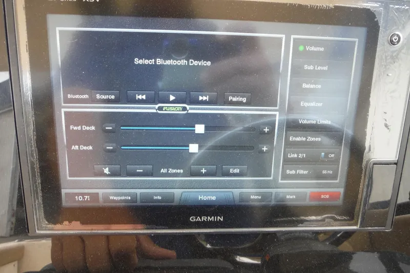 Slide: The Image of Garmin display on 2017 Scout 255 Dorado, showing Bluetooth audio settings and controls. - 23