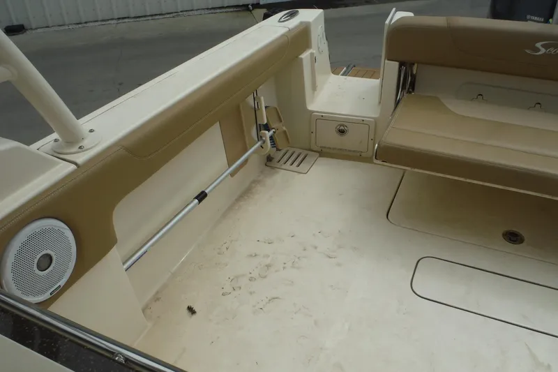 Slide: The Image of 2017 Scout 255 Dorado boat interior with beige seating and speaker. - 27