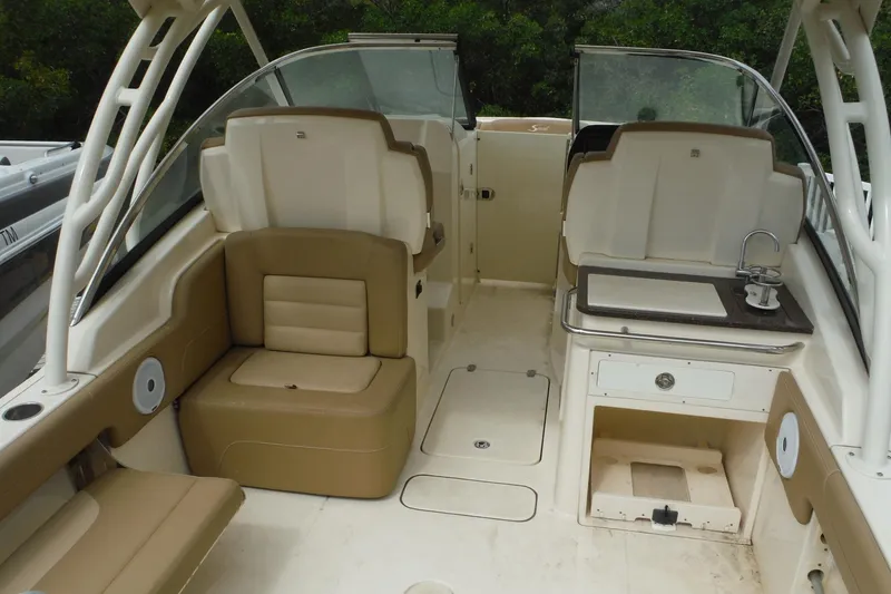 Slide: The Image of 2017 Scout 255 Dorado boat interior with seating and kitchenette. - 29