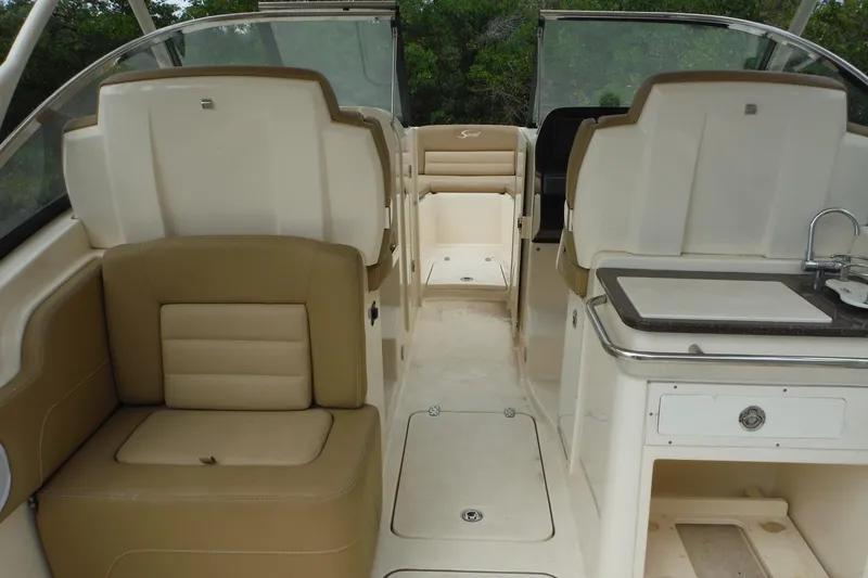 Slide: The Image of 2017 Scout 255 Dorado boat interior with seating and kitchenette area. - 33