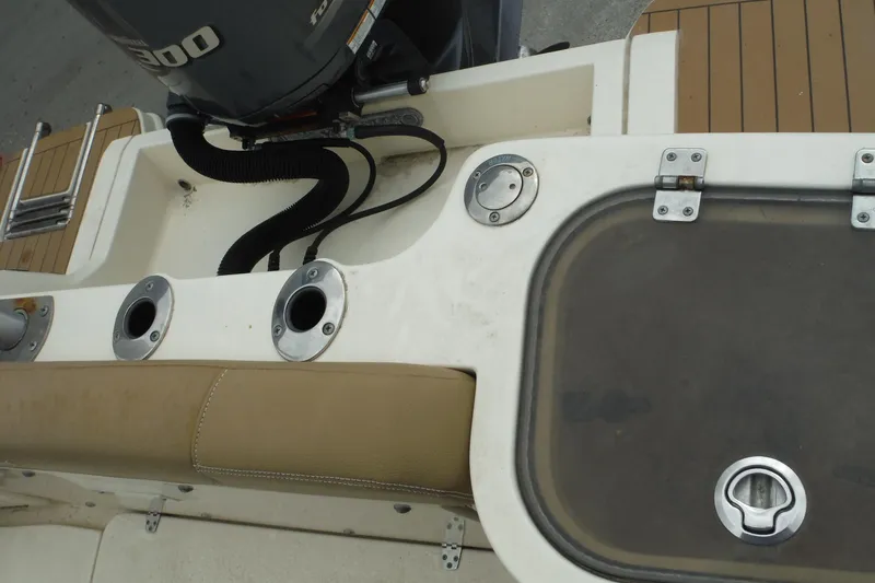 Slide: The Image of 2017 Scout 255 Dorado boat deck with motor and seating area. - 35