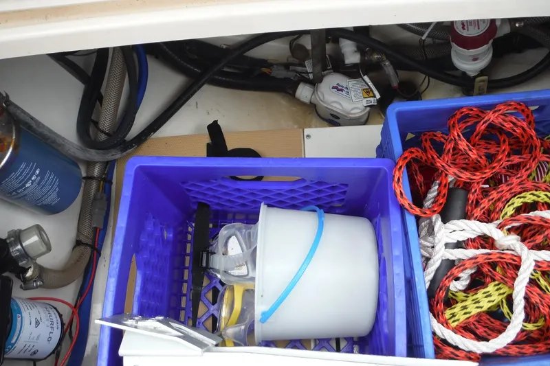 Slide: The Image of Storage compartment of a 2017 Scout 255 Dorado boat with ropes and equipment. - 37