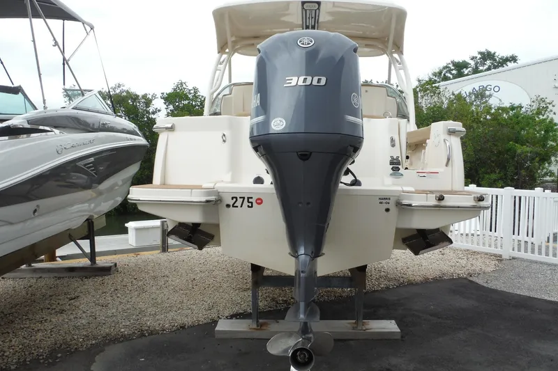 Slide: The Image of 2017 Scout 255 Dorado boat with Yamaha 300 outboard motor displayed outdoors. - 4