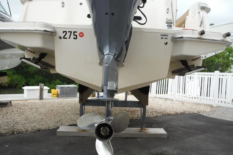 Slide: The Image of Rear view of a 2017 Scout 255 Dorado boat on a stand, showcasing the propeller. - 40