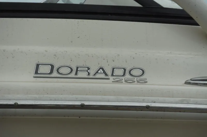 Slide: The Image of 2017 Scout 255 Dorado boat emblem on a white surface. - 46