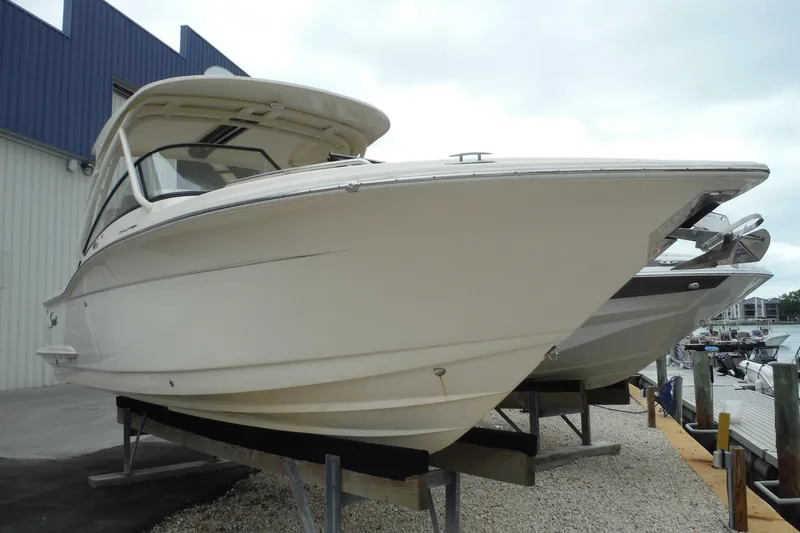 Slide: The Image of 2017 Scout 255 Dorado boat on display at a marina. - 48