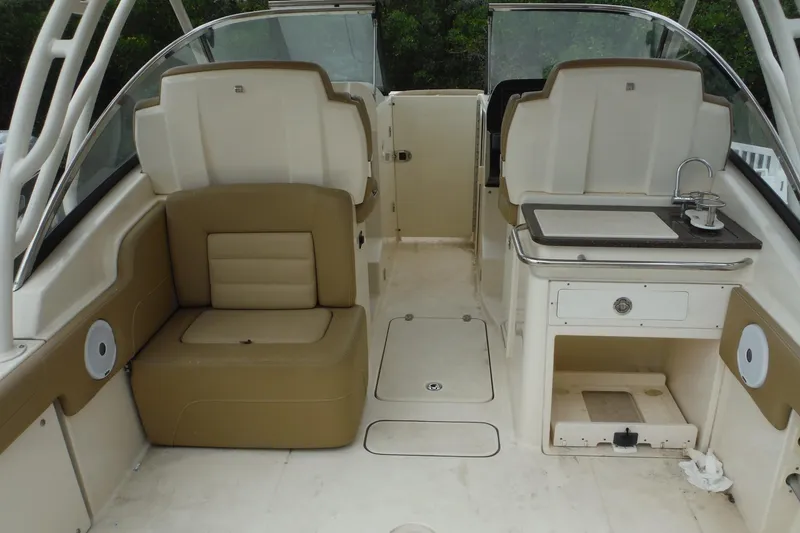 Slide: The Image of 2017 Scout 255 Dorado boat interior with seating and kitchenette area. - 5