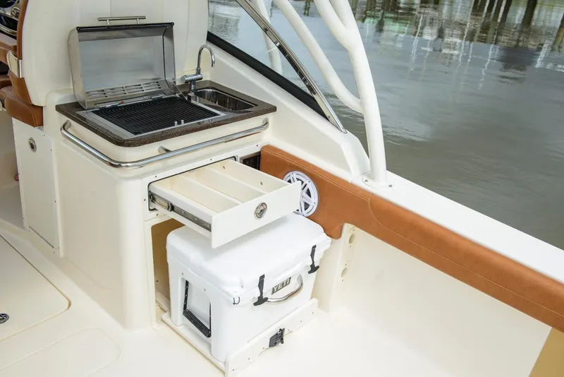 Slide: The Image of Manufacturer Provided Image: 2017 Scout 255 Dorado boat with built-in grill, sink, and storage drawer. - 6