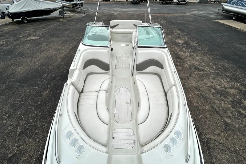 Slide: The Image of 2001 Crownline 239 DB boat with spacious seating and sleek design. - 11