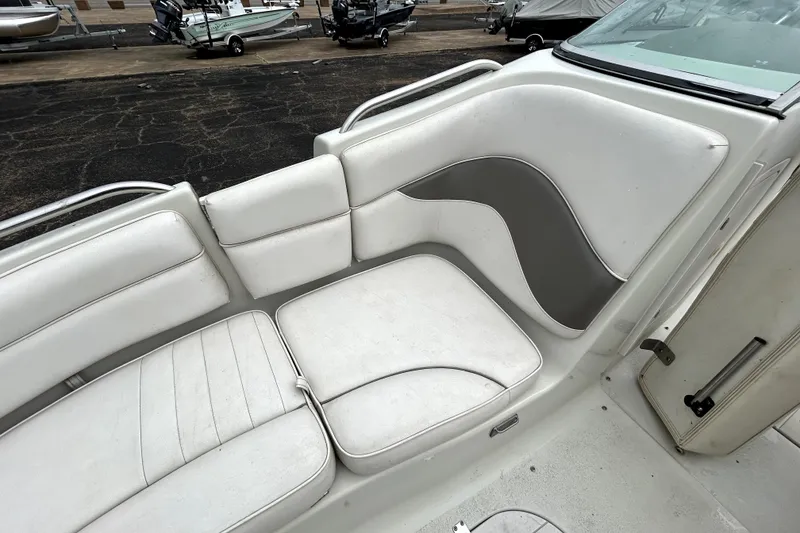 Slide: The Image of White seating area on a 2001 Crownline 239 DB boat, featuring sleek design and comfortable cushions. - 17
