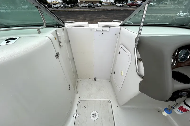 Slide: The Image of Interior view of a 2001 Crownline 239 DB boat, featuring seating and dashboard. - 22