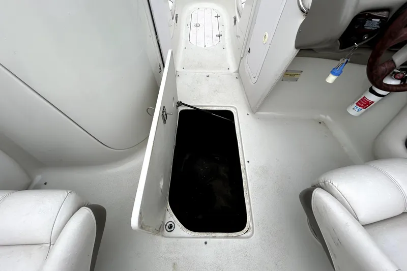 Slide: The Image of Open storage compartment on 2001 Crownline 239 DB boat interior. - 29