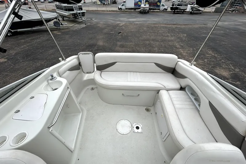 Slide: The Image of Interior of 2001 Crownline 239 DB boat with white seating and compact sink area. - 33