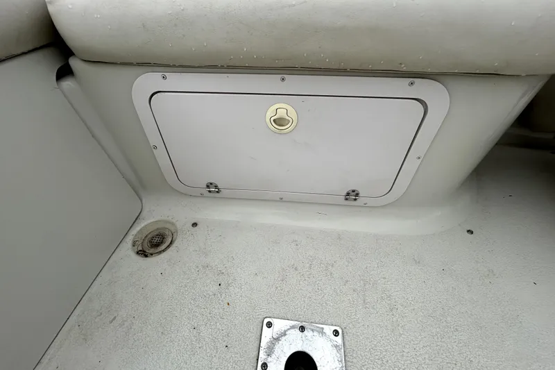 Slide: The Image of Storage compartment on a 2001 Crownline 239 DB boat interior. - 34