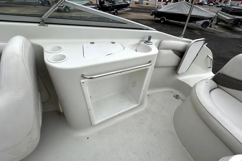 Slide: The Image of Interior of 2001 Crownline 239 DB boat with seating and storage area. - 36