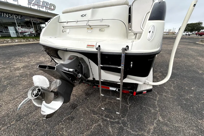Slide: The Image of Rear view of 2001 Crownline 239 DB boat with propeller and ladder. - 8