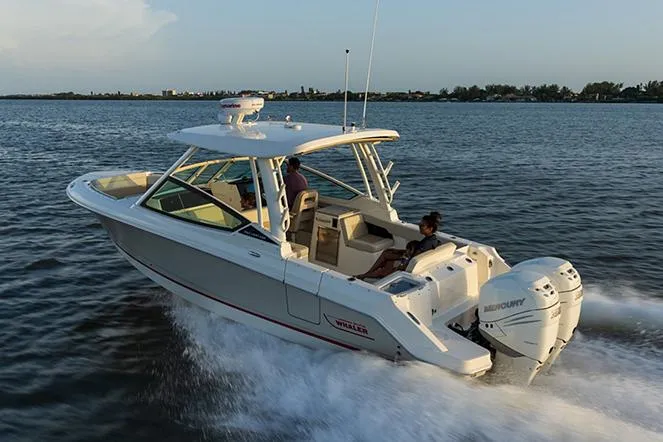 Slide: The Image of Manufacturer Provided Image: 2026 Boston Whaler 280 Vantage cruising on open water at sunset. - 2
