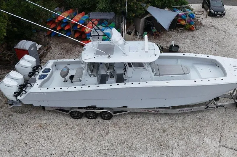 Slide: The Image of Aerial view of 2025 Freeman 42LR boat on trailer with multiple outboard engines. - 39