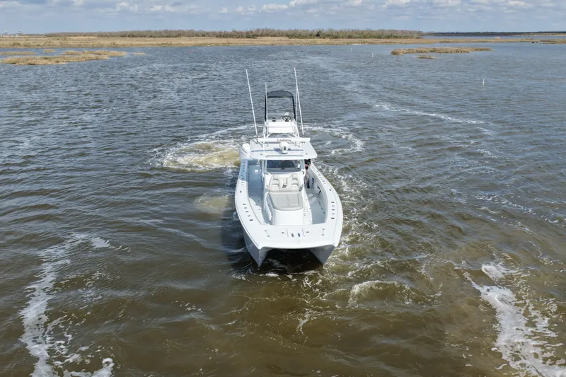 Slide: The Image of Freeman 42LR 2025 boat navigating through open waters on a clear day. - 7
