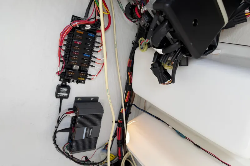 Slide: The Image of Electrical wiring and components inside a 2016 Sportsman Heritage 231 Center Console boat. - 100