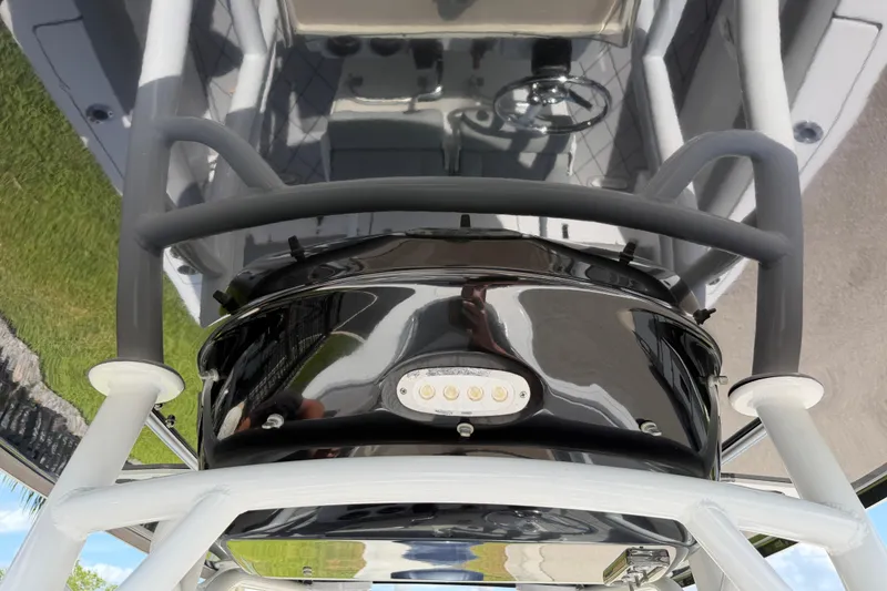 Slide: The Image of 2016 Sportsman Heritage 231 Center Console boat interior with steering wheel and seating. - 103