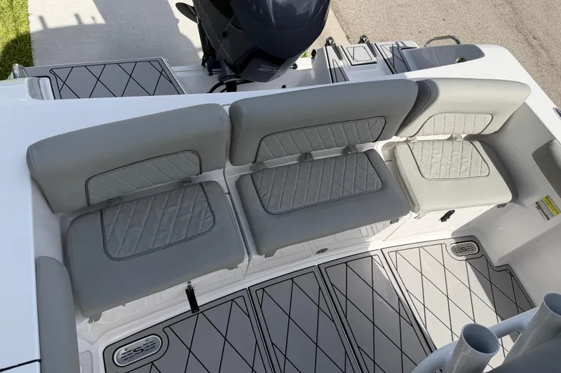 Slide: The Image of 2016 Sportsman Heritage 231 Center Console boat with gray cushioned seating and deck. - 112