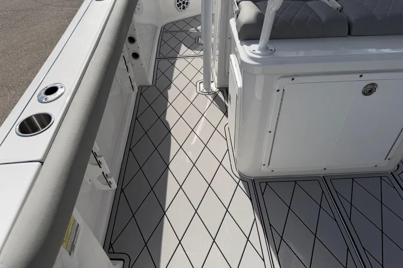 Slide: The Image of 2016 Sportsman Heritage 231 Center Console boat interior with diamond-patterned flooring. - 116