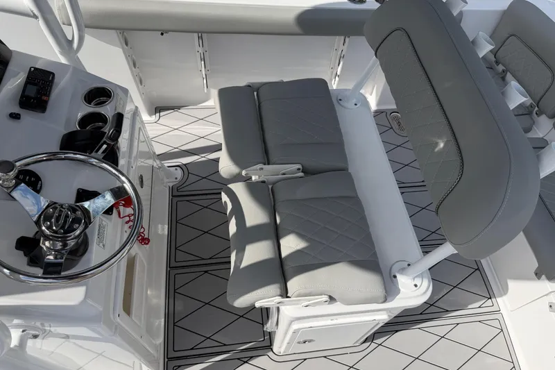 Slide: The Image of 2016 Sportsman Heritage 231 Center Console interior with steering wheel and seating. - 120
