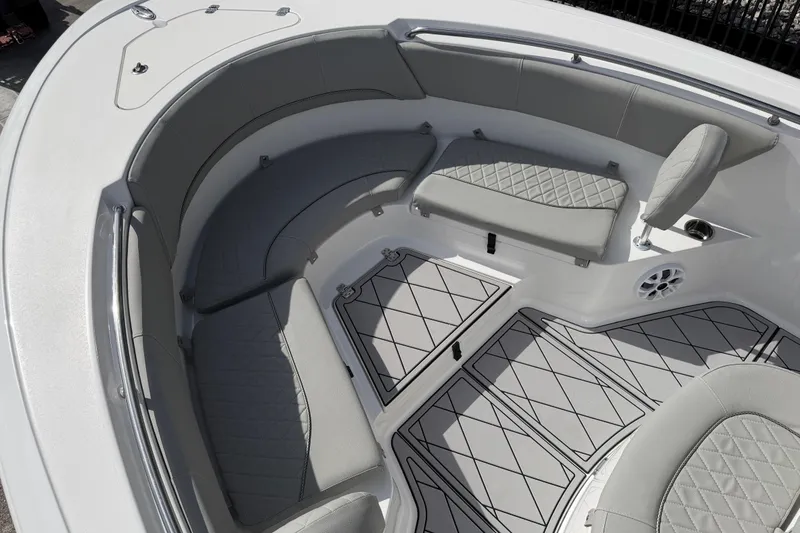 Slide: The Image of 2016 Sportsman Heritage 231 Center Console boat with cushioned seating and non-slip flooring. - 123