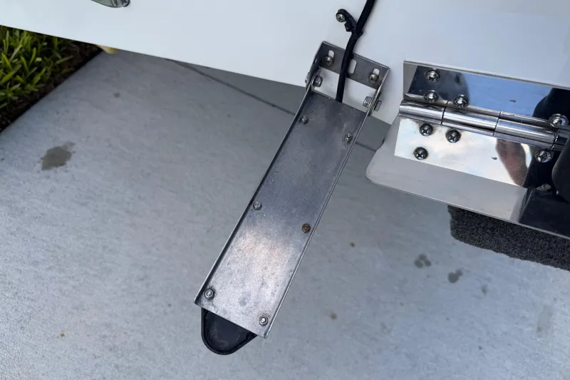 Slide: The Image of Trim tab on a 2016 Sportsman Heritage 231 Center Console boat. - 13