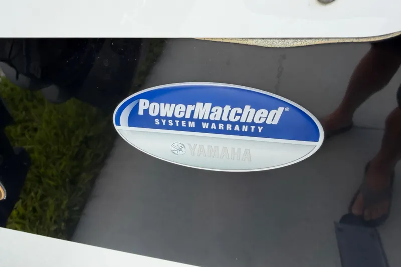 Slide: The Image of PowerMatched System Warranty badge on 2016 Sportsman Heritage 231 Center Console boat. - 14