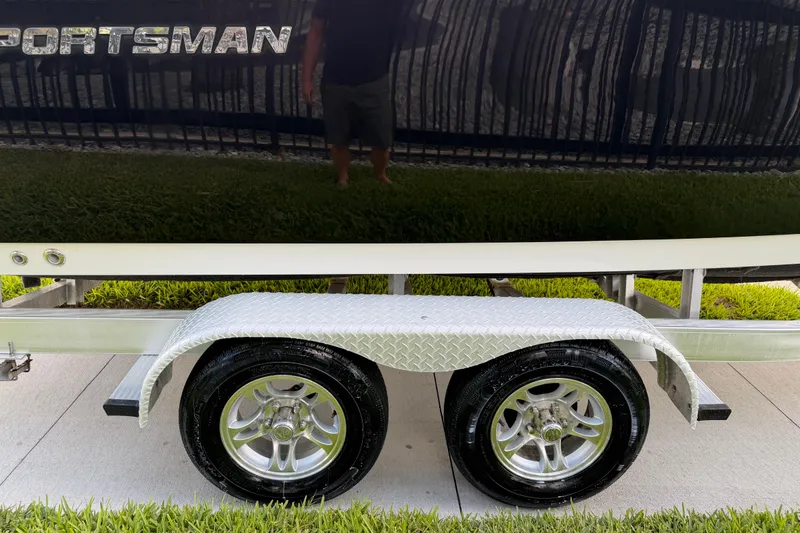 Slide: The Image of Trailer with dual wheels for 2016 Sportsman Heritage 231 Center Console boat. - 17