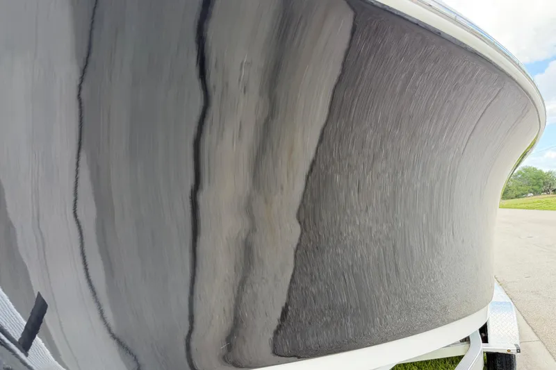 Slide: The Image of 2016 Sportsman Heritage 231 Center Console boat hull on trailer, close-up view. - 20