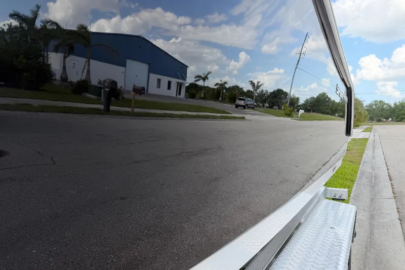 Slide: The Image of Reflection of a street scene on a 2016 Sportsman Heritage 231 Center Console boat. - 22