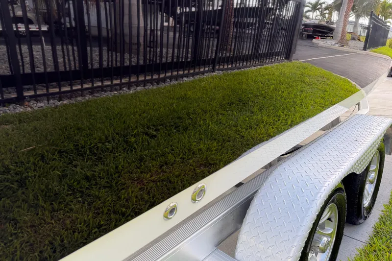 Slide: The Image of 2016 Sportsman Heritage 231 Center Console on trailer, reflecting grass and surroundings. - 26