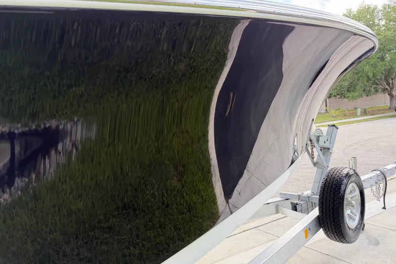 Slide: The Image of 2016 Sportsman Heritage 231 Center Console boat on trailer, glossy hull finish. - 28