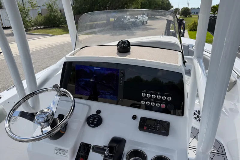 Slide: The Image of 2016 Sportsman Heritage 231 Center Console dashboard with steering wheel and navigation display. - 30