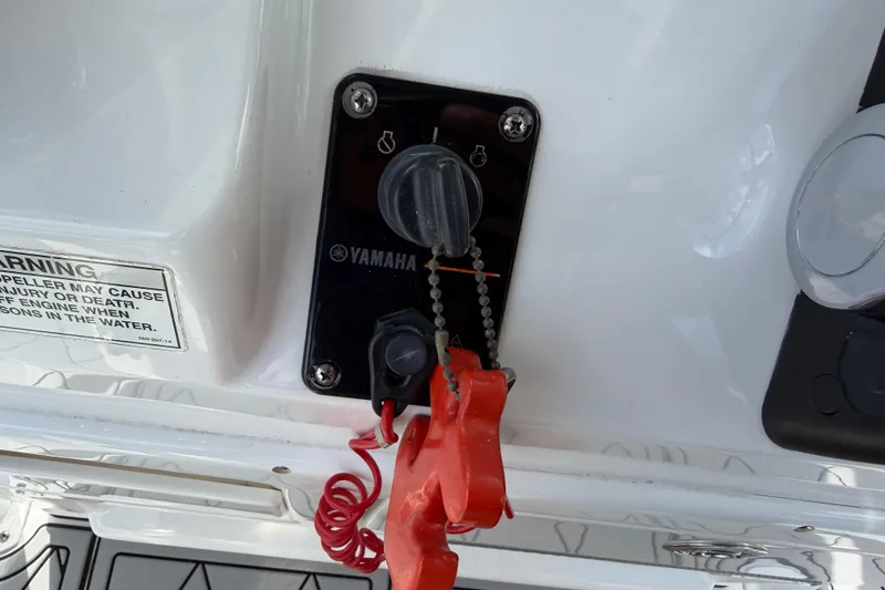 Slide: The Image of 2016 Sportsman Heritage 231 Center Console ignition switch with safety lanyard and warning label. - 34