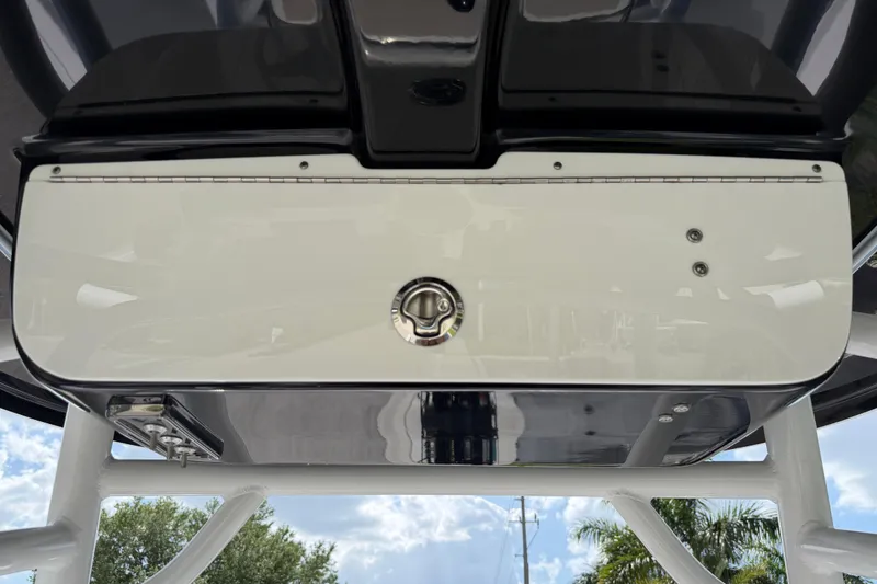 Slide: The Image of 2016 Sportsman Heritage 231 Center Console boat's overhead storage compartment. - 38