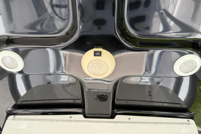 Slide: The Image of 2016 Sportsman Heritage 231 Center Console boat dashboard with speakers and controls. - 39