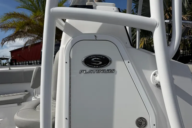 Slide: The Image of 2016 Sportsman Heritage 231 Center Console boat interior with logo and seating. - 4