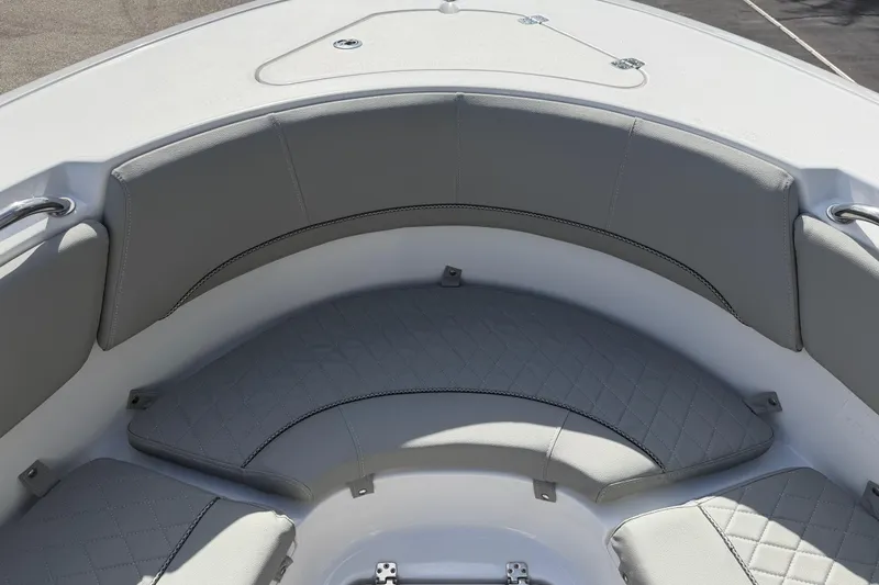 Slide: The Image of 2016 Sportsman Heritage 231 Center Console boat with cushioned seating area. - 44