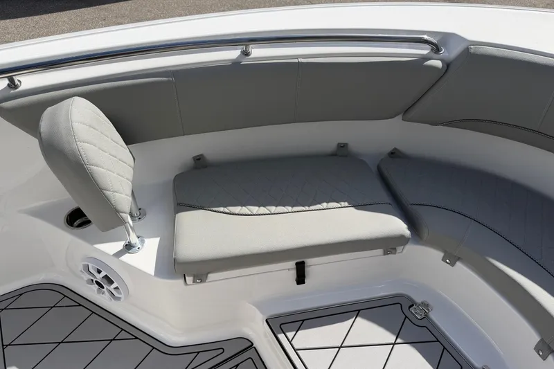 Slide: The Image of 2016 Sportsman Heritage 231 Center Console boat interior with cushioned seating and speaker. - 45