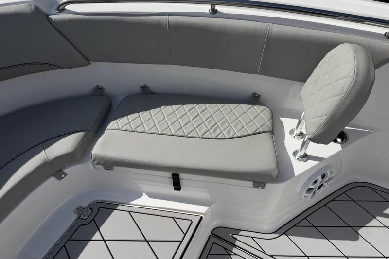 Slide: The Image of 2016 Sportsman Heritage 231 Center Console boat interior with gray cushioned seating. - 47