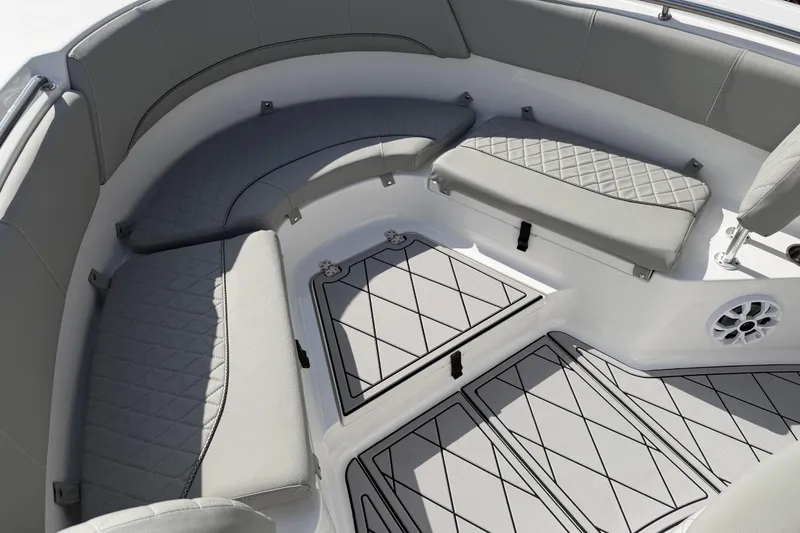 Slide: The Image of 2016 Sportsman Heritage 231 Center Console boat interior with cushioned seating and non-slip flooring. - 48