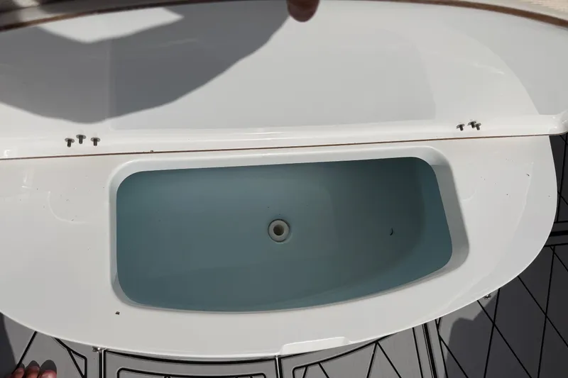 Slide: The Image of Livewell compartment on a 2016 Sportsman Heritage 231 Center Console boat. - 50
